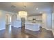 Open concept kitchen with white cabinets, stainless steel appliances, and an island at 2000 Winding Grove Ln, Moncks Corner, SC 29461