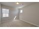 Simple bedroom with neutral walls, carpet, and a window at 2000 Winding Grove Ln, Moncks Corner, SC 29461