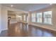 Spacious dining area with hardwood floors and access to the kitchen and backyard at 2000 Winding Grove Ln, Moncks Corner, SC 29461