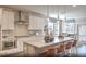 Modern kitchen with white cabinets, gray island, and stainless steel appliances at 4000 Winding Grove Ln, Moncks Corner, SC 29461
