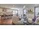 Open living space with kitchen, dining area, and fireplace at 4000 Winding Grove Ln, Moncks Corner, SC 29461