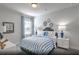 Cozy bedroom with blue and white bedding and a white dresser at 4000 Winding Grove Ln, Moncks Corner, SC 29461