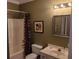Bathroom with tub/shower, toilet and vanity at 106 W Arctic Ave # 1D, Folly Beach, SC 29439