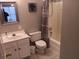 Bathroom with tub, toilet, and vanity at 106 W Arctic Ave # 1D, Folly Beach, SC 29439