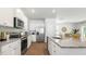 Modern kitchen with white cabinets and granite countertops at 214 Maple Hill Dr, Moncks Corner, SC 29461