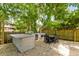 Outdoor kitchen with stone countertop and seating at 7 33Rd Ave, Isle of Palms, SC 29451