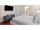Bedroom with a queen bed, TV, and ensuite bathroom access at 7 33Rd Ave, Isle of Palms, SC 29451