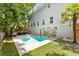 Inviting backyard oasis featuring a sparkling pool, mural, and patio furniture at 7 33Rd Ave, Isle of Palms, SC 29451