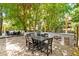 Outdoor kitchen with stone countertop and seating at 7 33Rd Ave, Isle of Palms, SC 29451