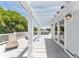 Stunning rooftop deck with pergola, lounge chairs, and white railings at 7 33Rd Ave, Isle of Palms, SC 29451