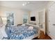 Bedroom with a queen bed, hardwood floors, and ensuite bathroom access at 7 33Rd Ave, Isle of Palms, SC 29451