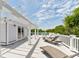Relaxing rooftop deck with pergola, lounge chairs, and partial ocean view at 7 33Rd Ave, Isle of Palms, SC 29451