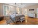 Spacious bedroom with king-size bed and en-suite bathroom at 252 Pelican Flight Dr, Dewees Island, SC 29451