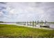 Community boat dock with several boats and lush marsh views at 252 Pelican Flight Dr, Dewees Island, SC 29451