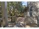 Stairs leading down from the deck to the backyard at 252 Pelican Flight Dr, Dewees Island, SC 29451