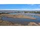 Aerial view of waterfront property with marsh and waterways at 252 Pelican Flight Dr, Dewees Island, SC 29451