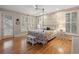 Main bedroom with king-size bed and private access to balcony at 252 Pelican Flight Dr, Dewees Island, SC 29451