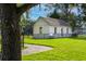 Historic building with white exterior, fenced yard, and lush green lawn at 1036 Teracotta Dr # 35, Charleston, SC 29407