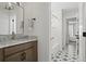 Modern bathroom with marble vanity,freestanding tub, and hexagon tile floor at 374 Wappoo Trace Ln, Summerville, SC 29486