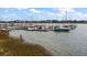 Peaceful waterfront view with boats docked at the marina at 82 Mariners Cay Dr, Folly Beach, SC 29439