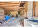 Unfinished garage with exposed beams and various materials at 1157 Symmes Dr, Charleston, SC 29407