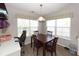 Dining area with table, chairs, and built-in workspace at 8217 Little Sydneys Way, North Charleston, SC 29406