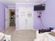 Bedroom with two twin beds, TV, and access to the laundry room at 8217 Little Sydneys Way, North Charleston, SC 29406