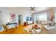 Bright living room with hardwood floors, comfortable seating, and water views at 14 Lockwood Dr # 10C, Charleston, SC 29401