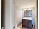 Clean bathroom with dark vanity, mirror, and toilet at 14 Lockwood Dr # 10C, Charleston, SC 29401