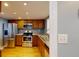 Galley kitchen with stainless steel appliances and wood cabinets at 14 Lockwood Dr # 10C, Charleston, SC 29401