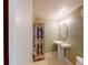Small bathroom with pedestal sink, cabinet, and toilet at 14 Lockwood Dr # 10C, Charleston, SC 29401