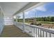 Covered balcony overlooking a pond and other houses under construction at 1161 Oak Bluff Ave, Charleston, SC 29492
