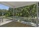 Spacious screened porch with wood decking and views of lush greenery at 1161 Oak Bluff Ave, Charleston, SC 29492