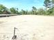 Vacant lot ready for new construction, surrounded by trees and nature at 214 Greenling St, Goose Creek, SC 29445