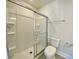 Small bathroom with sliding shower door and toilet at 212 Greenling St, Goose Creek, SC 29445