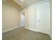 Simple bedroom with grey carpet, neutral walls, and white door at 212 Greenling St, Goose Creek, SC 29445