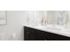 Double vanity bathroom with dark cabinets and a shower/tub combo at 212 Greenling St, Goose Creek, SC 29445