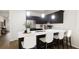 Modern kitchen with dark cabinetry and a breakfast bar at 212 Greenling St, Goose Creek, SC 29445