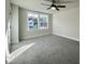 Bright bedroom with grey carpet and ceiling fan at 212 Greenling St, Goose Creek, SC 29445