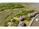 Aerial view of waterfront community with boat slips and lush landscaping at 1934 Marsh Oak Ln, Seabrook Island, SC 29455