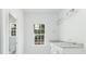 Bathroom with granite countertop double vanity and window at 105 Equestrian Ct, Summerville, SC 29486