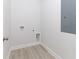 Simple laundry room with vinyl flooring and hookups for a washer and dryer at 105 Equestrian Ct, Summerville, SC 29486