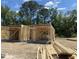 New home construction in progress, showing framing and foundation at 208 Greenling St, Goose Creek, SC 29445