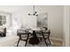 Charming dining area with a round table and four chairs, near the living room at 208 Greenling St, Goose Creek, SC 29445