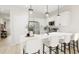 Modern kitchen with white shaker cabinets, quartz countertops, and island seating at 208 Greenling St, Goose Creek, SC 29445