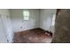 Small bedroom needing renovation, with damaged flooring at 189 Joe Felder Rd, Ridgeville, SC 29472