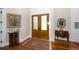 Elegant entryway with hardwood floors, double doors, and antique furniture at 2128 Rookery Ln, Charleston, SC 29414