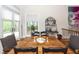 Bright dining room with hardwood floors, a wooden table, and French doors at 2128 Rookery Ln, Charleston, SC 29414