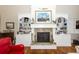 Elegant fireplace with built-in shelving and marble surround at 2128 Rookery Ln, Charleston, SC 29414