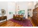 Spacious dining room with hardwood floors, large windows, and a formal dining set at 2128 Rookery Ln, Charleston, SC 29414